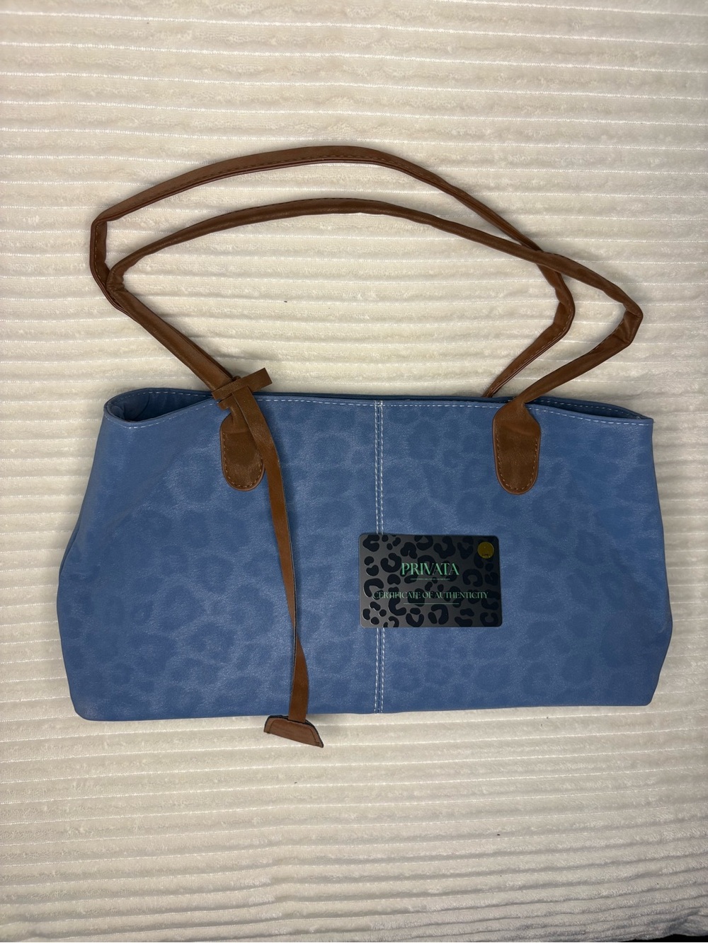 Privata’s Blue Leopard-Print Shoulder Bag with Brown Straps